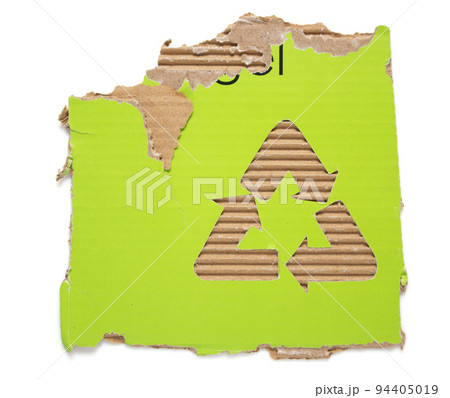 Recycle symbol and cardboard waste paper isolated at white background texture Recycle symbol and cardboard waste paper isolated at white background texture 94405019