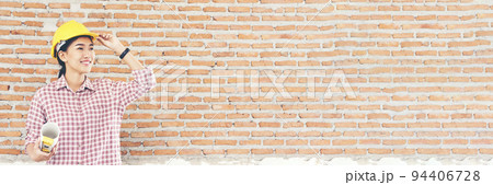 Banner Woman worker hands holding hardhat yellow work helmet Construction Engineer. Panorama Refinery woman worker industry hand hold yellow worker helmet hard hat. Refinery industry with copy space 94406728