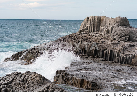 rocks formed by columnar basalt among the sea surf, Cape Stolbchaty on Kunashir Island rocks formed by columnar basalt among the sea surf, Cape Stolbchaty on Kunashir Island 94406920