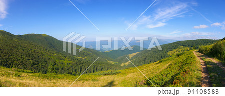 panorama of a green mountain landscape. wonderful view in to the distant valley in morning light. explore the beauty in nature of ukraine. travel season in trascarpathia 94408583