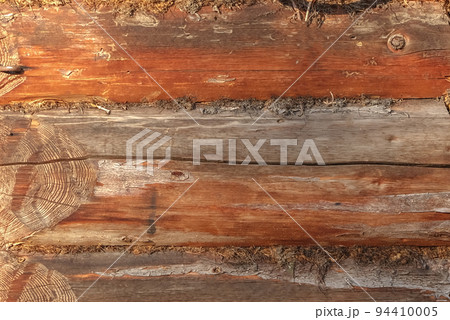 The texture of an old log house. The background of The texture of an old log house. The background of 94410005