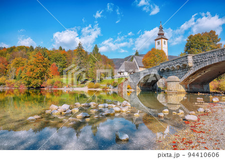 Gorgeous view of Church of St. John the Baptist on Bohinj Lake . Gorgeous view of Church of St. John the Baptist on Bohinj Lake . 94410606