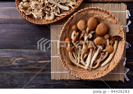 Fresh yanagi matsutake mushroom in basket on wooden background, Table top view Fresh yanagi matsutake mushroom in basket on wooden background, Table top view 94426283