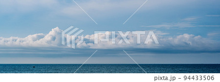 BANNER, LONG FORMAT, crop it. Atmosphere panorama white cloud clear blue sky horizon line calm empty sea. Concept paradise life. Design relax wallpaper background. More tone format collection in stock BANNER, LONG FORMAT, crop it. Atmosphere panorama white cloud clear blue sky horizon line calm empty sea. Concept paradise life. Design relax wallpaper background. More tone format collection in stock 94433506