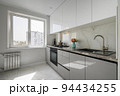 Small White modern domestic kitchen interior with furniture 94434255