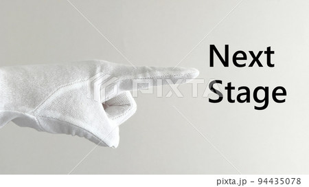 白手袋の人差し指とNextStage文字_横向き_白壁背景_ワイド 白手袋の人差し指とNextStage文字_横向き_白壁背景_ワイド 94435078