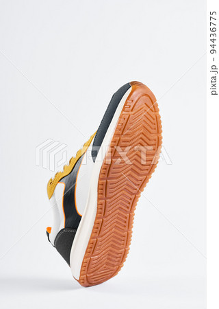Trendy fashionable sneakers with sole on white background. Stylish sports casual shoes. Creative minimalistic layout with footwear Trendy fashionable sneakers with sole on white background. Stylish sports casual shoes. Creative minimalistic layout with footwear 94436775