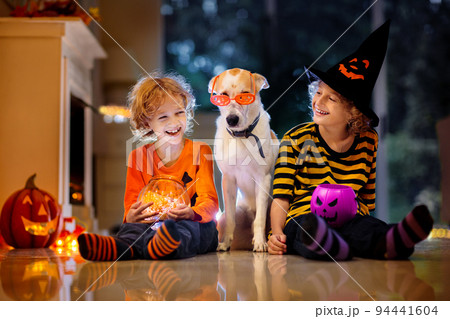 Kids in witch costume on Halloween trick or treat Kids in witch costume on Halloween trick or treat 94441604