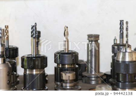 Close-up scene the group of used cutting tools for CNC milling machine. Close-up scene the group of used cutting tools for CNC milling machine. 94442138