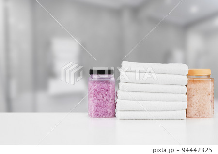 Various spa beauty threatment products and towels against blurred background 94442325