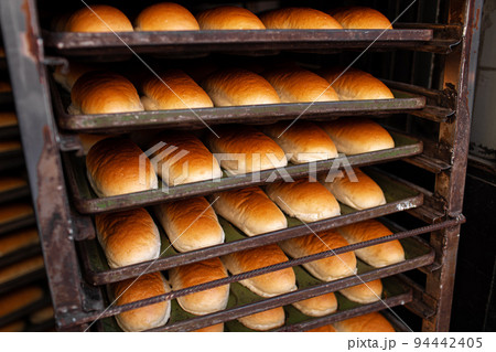 Freshly baked bread loafs on a shelf 94442405