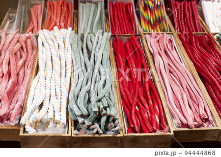 Variety of jelly beans and candies in a store. Unhealthy and fattening concept Variety of jelly beans and candies in a store. Unhealthy and fattening concept 94444868