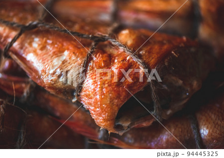 smoked fish sea bass on the table. homemade smoking smoked fish sea bass on the table. homemade smoking 94445325