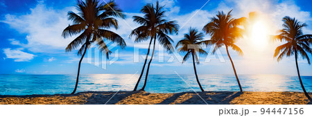 Fantasy Island. Palm trees, Sunset sea landscape. Colorful ocean beach sunrise Fantasy Island. Palm trees, Sunset sea landscape. Colorful ocean beach sunrise 94447156