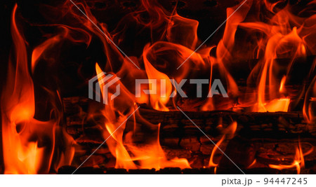 Fire. Fire texture. Burning wood in the fireplace. Close-Up Of Fire In The Dark. Fire flames burning isolated on black background. Fire. Fire texture. Burning wood in the fireplace. Close-Up Of Fire In The Dark. Fire flames burning isolated on black background. 94447245