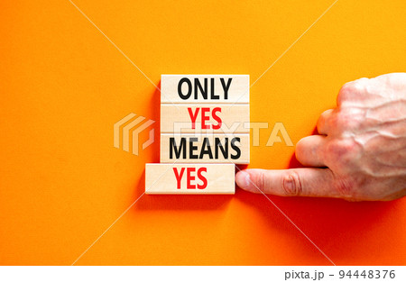 Only yes means yes symbol. Concept words Only yes means yes on wooden blocks on a beautiful orange table orange background. Businessman hand. Business, psychological only yes means yes concept. 94448376