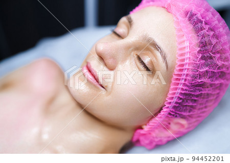 Close-up woman face in beauty spa on couch. Relaxation, rejuvenation 94452201
