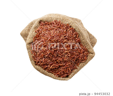 organic red rice in sack isolated on white background top view. 94453032
