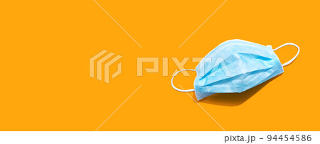 Blue surgical mask overhead view Blue surgical mask overhead view 94454586
