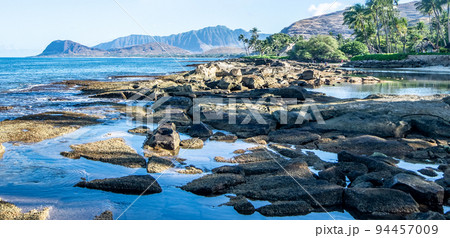 beautiful blue sky and beach scenes on secret beach oahu hwaii 94457009