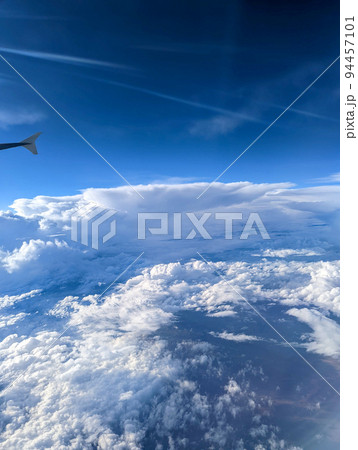 flying high in the sky with beautiful clouds 94457101