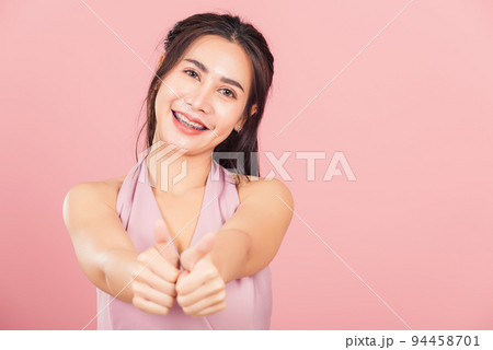 woman smile she standing made finger thumbs up woman smile she standing made finger thumbs up 94458701
