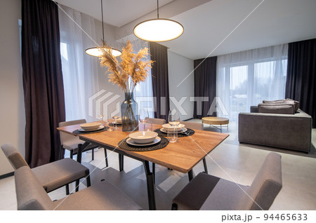 Dining area and lounge in a contemporary studio apartment 94465633