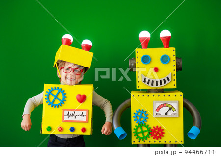 Happy child with a robot Happy child with a robot 94466711
