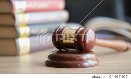 Wooden gavel of judges and law book in courtroom Wooden gavel of judges and law book in courtroom 94467407