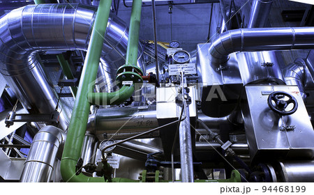 Equipment, cables and piping as found inside of a modern industrial power plant 94468199