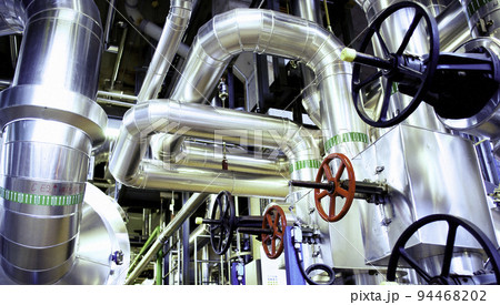 Equipment, cables and piping as found inside of a modern industrial power plant 94468202