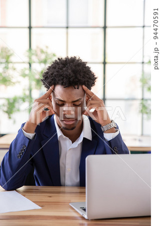 Portrait of concentrated male office worker 94470591