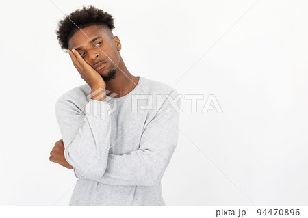 Portrait of bored African American man looking away 94470896