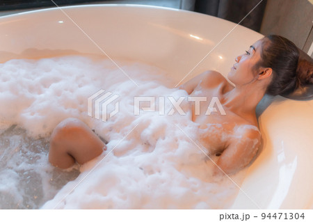 Beautiful young asian sexy woman relax smile leisure in bathtub in bathroom Beautiful young asian sexy woman relax smile leisure in bathtub in bathroom 94471304