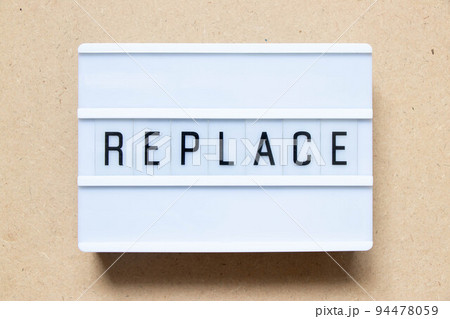 Lightbox with word replace on wood background 94478059
