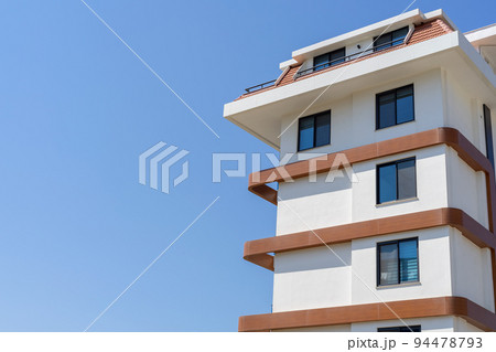 Residential apartment building. Blue sky. 94478793