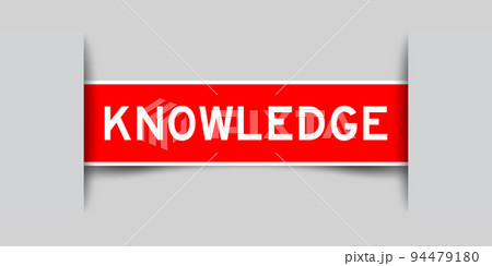 Inserted red label sticker with word knowledge on gray background 94479180