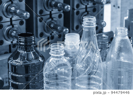The various type of plastic bottles with injection mold background. The various type of plastic bottles with injection mold background. 94479446