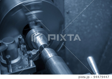 The lathe machine finish cut the metal shaft parts by lathe tools.. The lathe machine finish cut the metal shaft parts by lathe tools.. 94479447