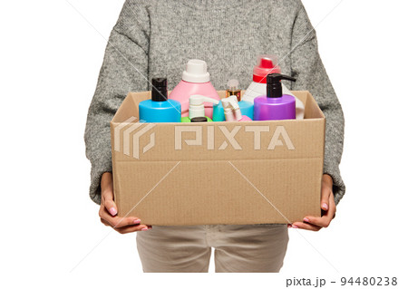 Anonymous woman holding carton box with donation, goods isolated on white background. Concept of assistant, help, support to refugees, migrants. Anonymous woman holding carton box with donation, goods isolated on white background. Concept of assistant, help, support to refugees, migrants. 94480238