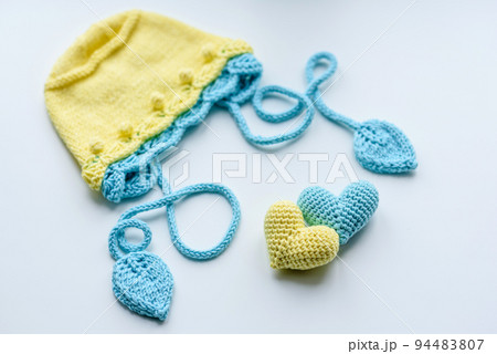 Beautiful baby knitted clothes and a toys for a newborn baby Beautiful baby knitted clothes and a toys for a newborn baby 94483807