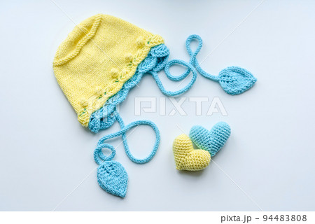 Beautiful baby knitted clothes and a toys for a newborn baby 94483808