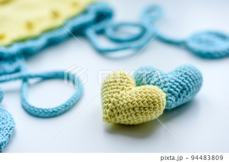 Beautiful baby knitted clothes and a toys for a newborn baby Beautiful baby knitted clothes and a toys for a newborn baby 94483809
