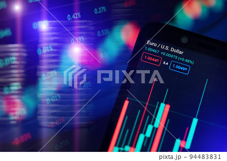 Stock market graph of Euro and US Dollar with Volume indicator in a smartphone against the blurred background of graphs and stacks of coins Stock market graph of Euro and US Dollar with Volume indicator in a smartphone against the blurred background of graphs and stacks of coins 94483831