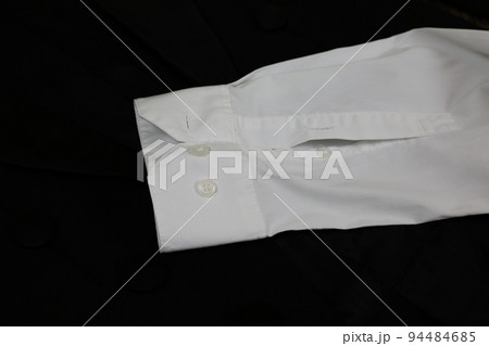 Classic tailcoat suit. White shirt, white bow tie and black jacket. Suit for ballroom dancing. Wedding accessories 94484685