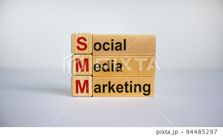 Concept words 'SMM, social media marketing' on cubes and blocks on a beautiful white background. Business concept. Copy space. Concept words 'SMM, social media marketing' on cubes and blocks on a beautiful white background. Business concept. Copy space. 94485297
