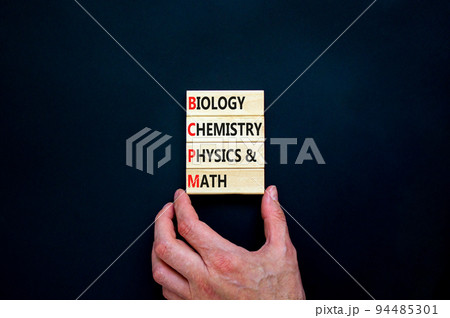 BCPM biology chemistry physics math symbol. Concept words BCPM biology chemistry physics math on wooden blocks on beautiful black background. Business BCPM biology chemistry physics math concept. 94485301