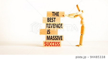 Revenge or success symbol. Concept words The best revenge is massive success on wooden blocks. Bussinesman hand. Beautiful white background. Business and revenge or success concept. Copy space. Revenge or success symbol. Concept words The best revenge is massive success on wooden blocks. Bussinesman hand. Beautiful white background. Business and revenge or success concept. Copy space. 94485338