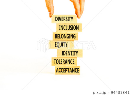 Diversity, inclusion symbol. Diversity belonging inclusion equity identity tolerance acceptance words on blocks. Businessman hand. Beautiful white background. Diversity inclusion belonging concept. Diversity, inclusion symbol. Diversity belonging inclusion equity identity tolerance acceptance words on blocks. Businessman hand. Beautiful white background. Diversity inclusion belonging concept. 94485341