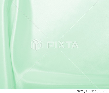 Smooth elegant green silk or satin luxury cloth texture as abstract background. Luxurious background design 94485859